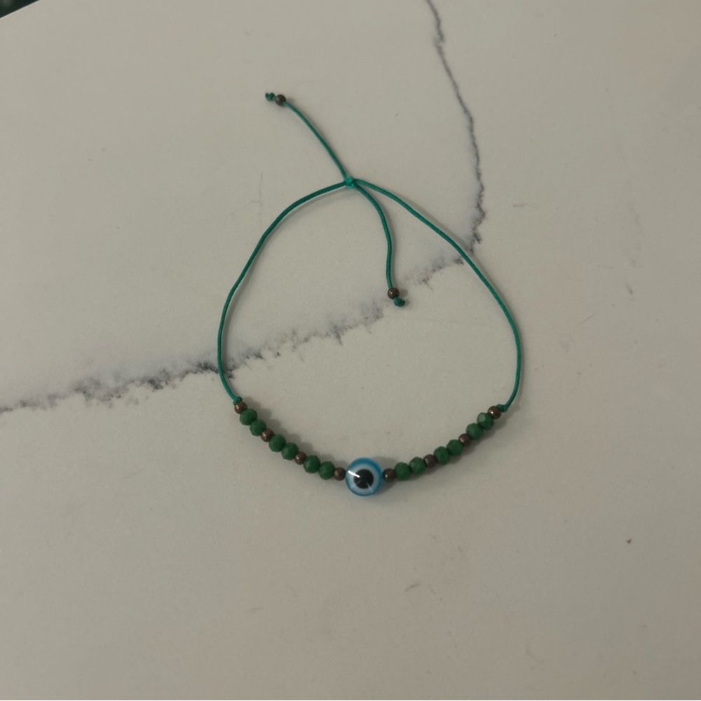 Green Beaded Bracelet with Blue Accent